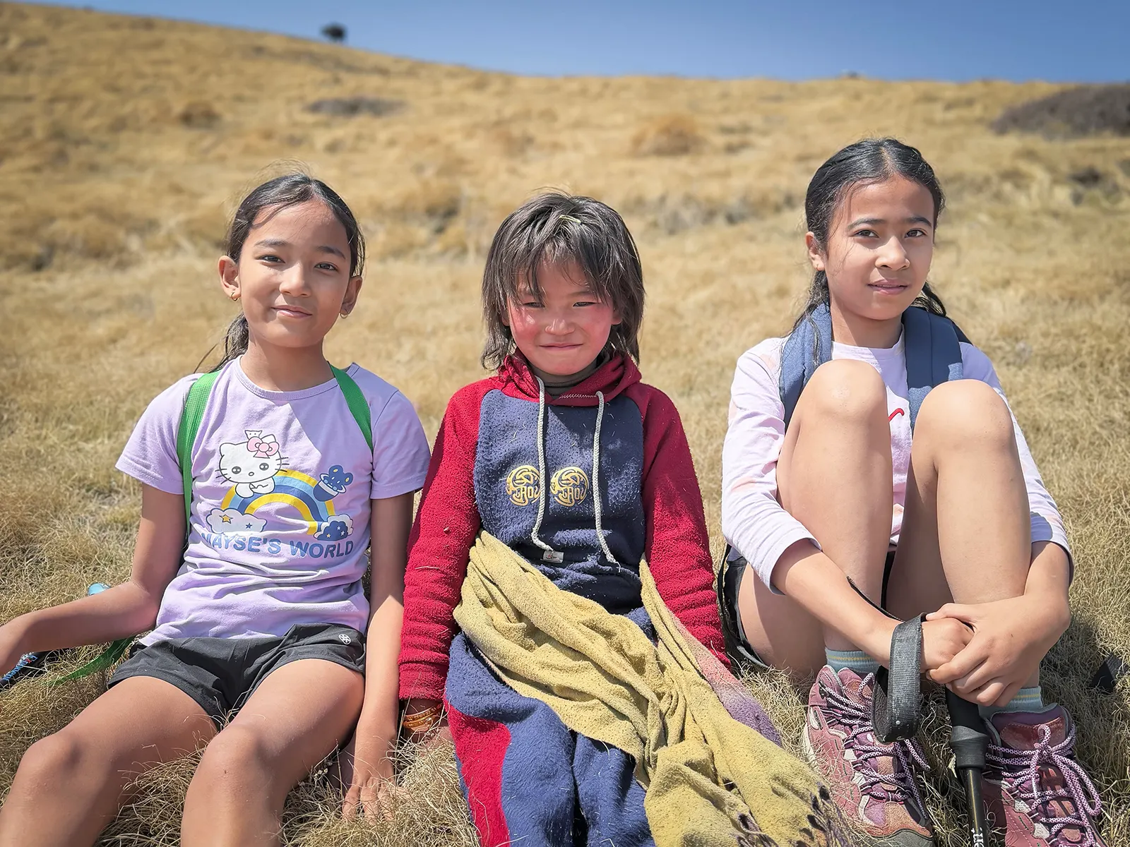 Our children with a young Sherpa girl tending her yaks along the Pikey Peak.