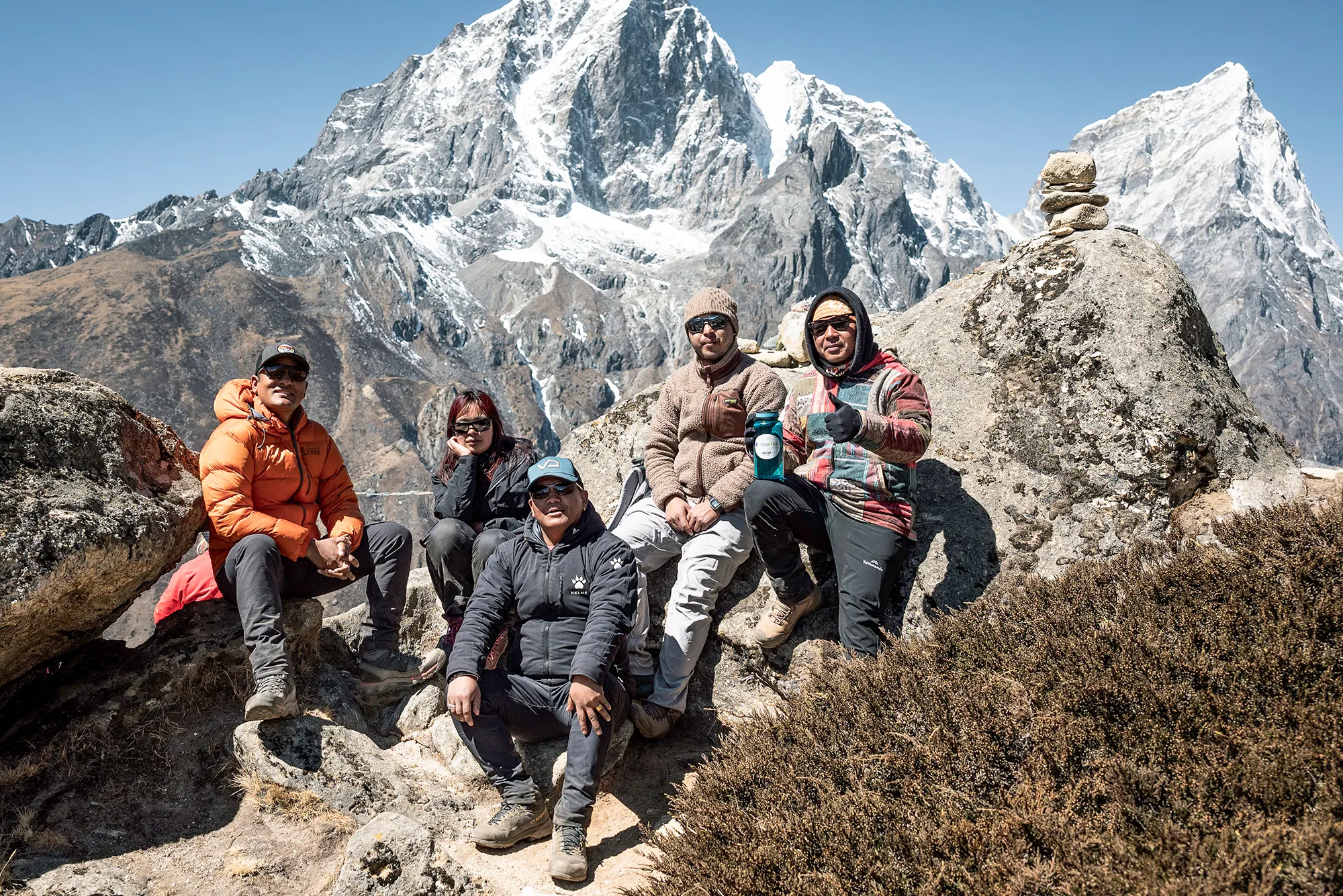 A Himalayan village beneath snow-covered mountains