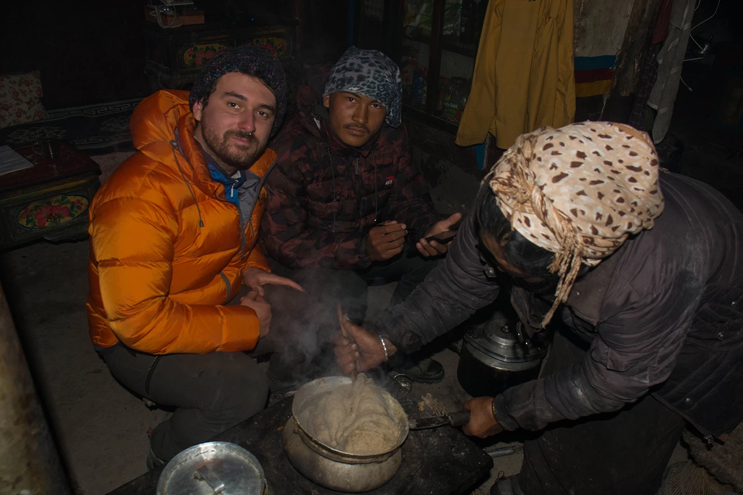  Local Lodge, woman preparing foods in winter, Upper Mustang. 